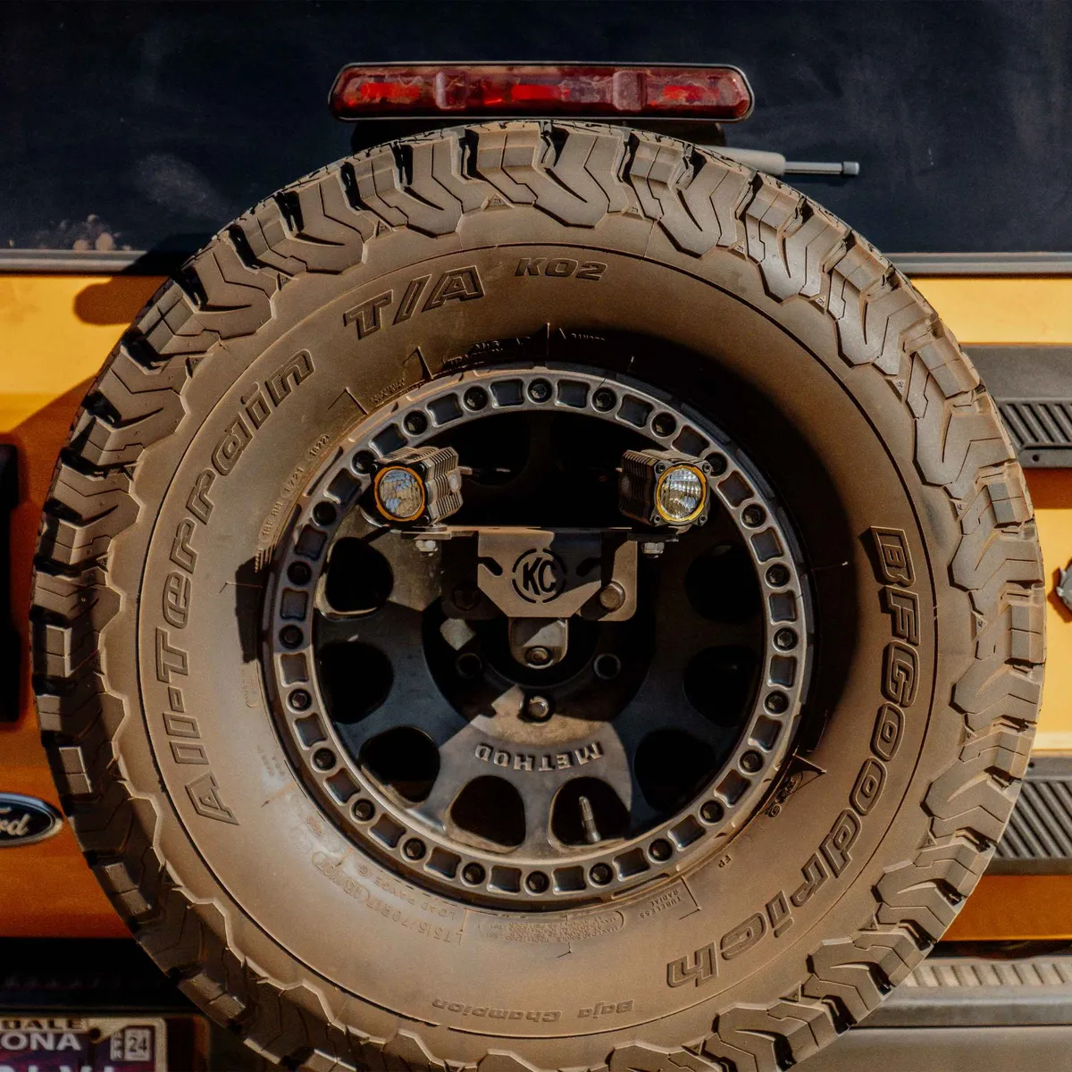 KC HiLiTES 7478 Spr Tir Carr (M14x1.5 Lug) - 18+ Jeep Wrangler JL /21+ Ford Bronco Raptor product image