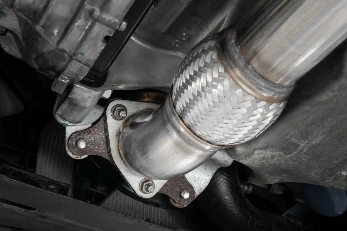 Armor Pro Cat Back Exhaust System; 3.0 in.; Triple Center Outlet; T304 Stainless Steel; 2 Outlets 4 in. Outer Diameter; 1 Outlet 5 in. Outer Diameter; w/Carbon Fiber Tips; product image