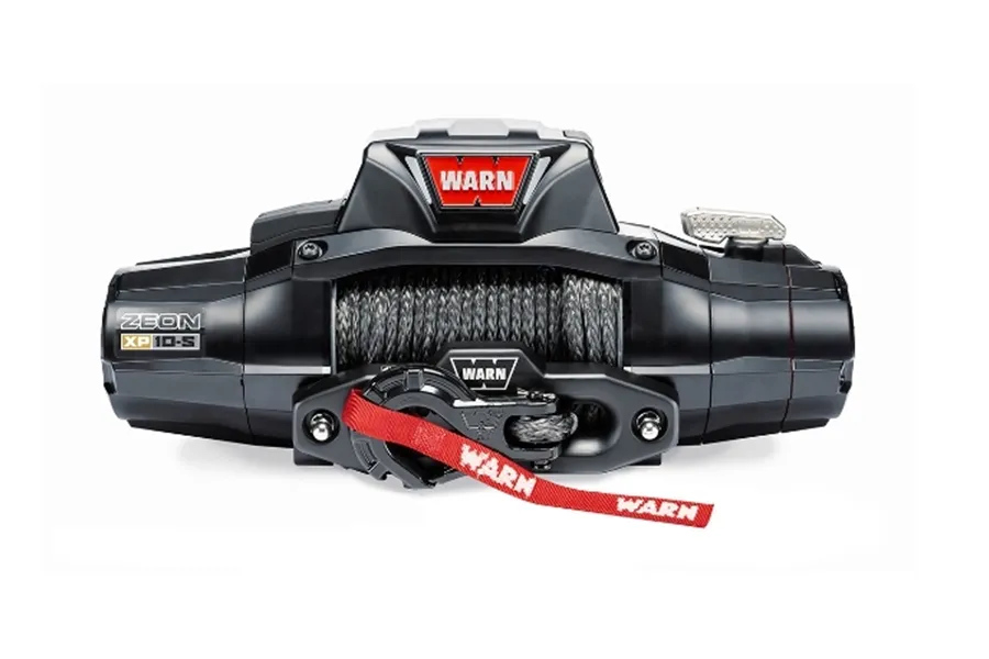 Warn ZEON XP 10-S electric winch with black housing, synthetic rope, and LED accent lighting mounted on vehicle