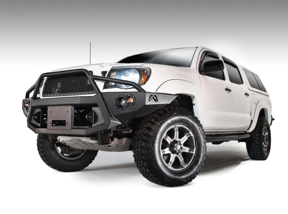 Fab Fours Premium Heavy Duty Winch Front Bumper; 2 Stage Black Powder Coated; w/Pre-Runner Grill Guard; Incl. 1in. D-Ring Mts./Light Cut-Outs w/Hella 90mm Fog Lamps/60mm Turn Signals;