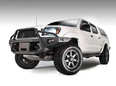 Fab Fours Premium Heavy Duty Winch Front Bumper; 2 Stage Black Powder Coated; w/Pre-Runner Grill Guard; Incl. 1in. D-Ring Mts./Light Cut-Outs w/Hella 90mm Fog Lamps/60mm Turn Signals;