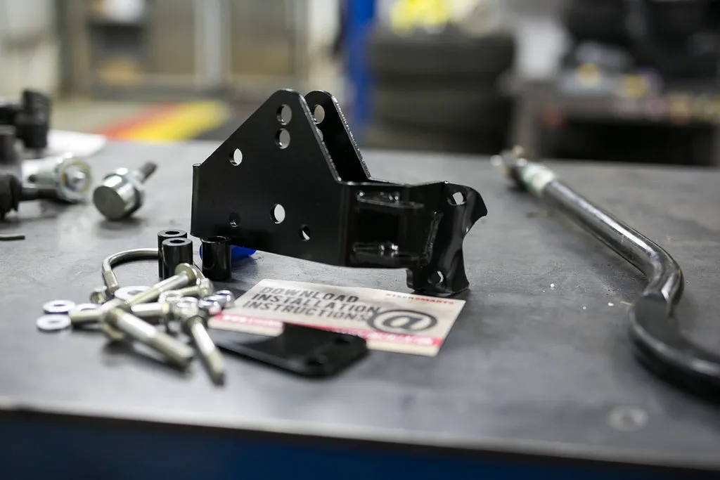 Steer Smarts 79017001 Relocation bracket corrects the trackbar geometry on top mounted draglink. product image