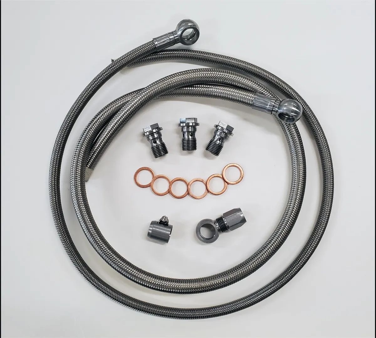 Borgeson stainless steel power steering hose kit; 2 pc. with banjo fittings. Fittings are crimped on one end. Connects GM pump to Borgeson conversion boxes part numbers 800110; 800111; 800114; 800115; 800117; 800126; 800127; 800131; 999062. product image