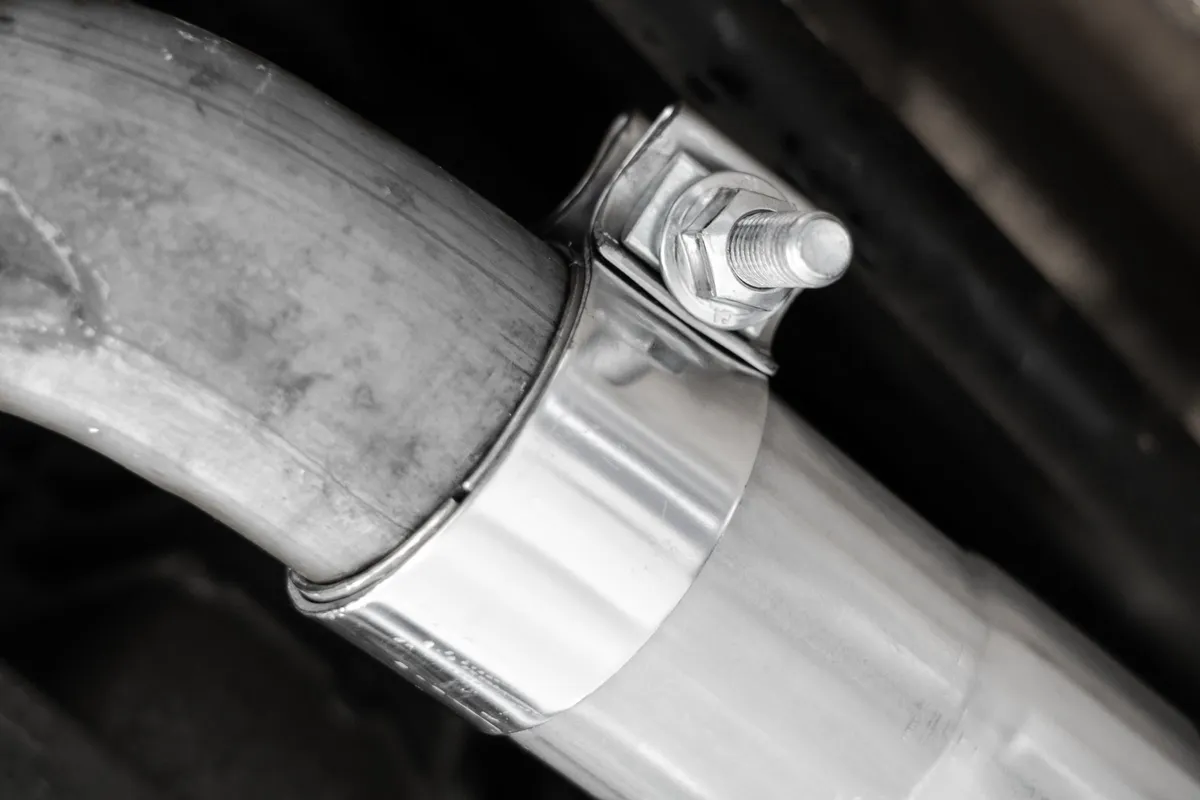 Armor Pro Axle Back Exhaust System; 2.5 in.; Dual Rear Exit; Quad 4 in. OD Carbon Fiber Tips; T304 Stainless Steel; product image