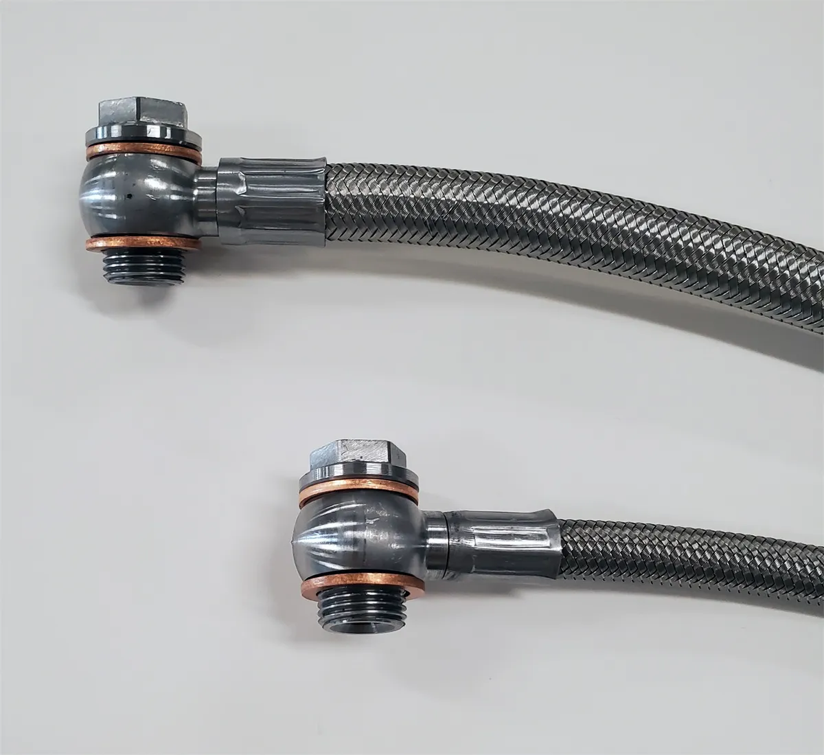 Borgeson stainless steel power steering hose kit; 2 pc. with banjo fittings. Fittings are crimped on one end. Connects GM pump to Borgeson conversion boxes part numbers 800110; 800111; 800114; 800115; 800117; 800126; 800127; 800131; 999062. product image