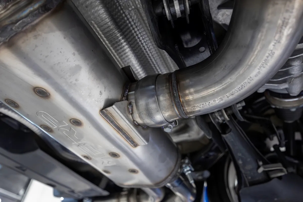 Armor Pro Cat Back Exhaust System; 3 in.; Quad Split Rear Exit; 4.5 in. Carbon Fiber Tips; w/Active Exhaust; T304 Stainless Steel; product image