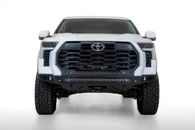 Addictive Desert Designs Stealth Fighter front bumper for the 2022-2023 Toyota Tundra is an aggressive modern radius plate design that fits tight around the Tundra s frontend. A steel plate design provides additional protection and a winch mount provides additional utility for yo