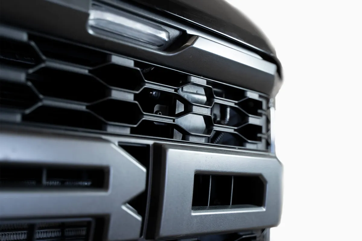 Our 3rd Gen Raptor Adaptive Cruise Control Bracket relocates the ACC sensor module behind the grille enabling you to retain functionality when installing an aftermarket Raptor front bumper. It is constructed from lightweight aluminum and powder coated in product image