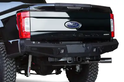 Addictive Desert Designs Ford F250 2017 - up HoneyBadger Rear Bumper with Integrated Tool Boxes on Sides with D-Ring Clevis Mounts and Mount Tab for Dually with Back Up Sensor Holes in Hammer Black with Satin Black Panels