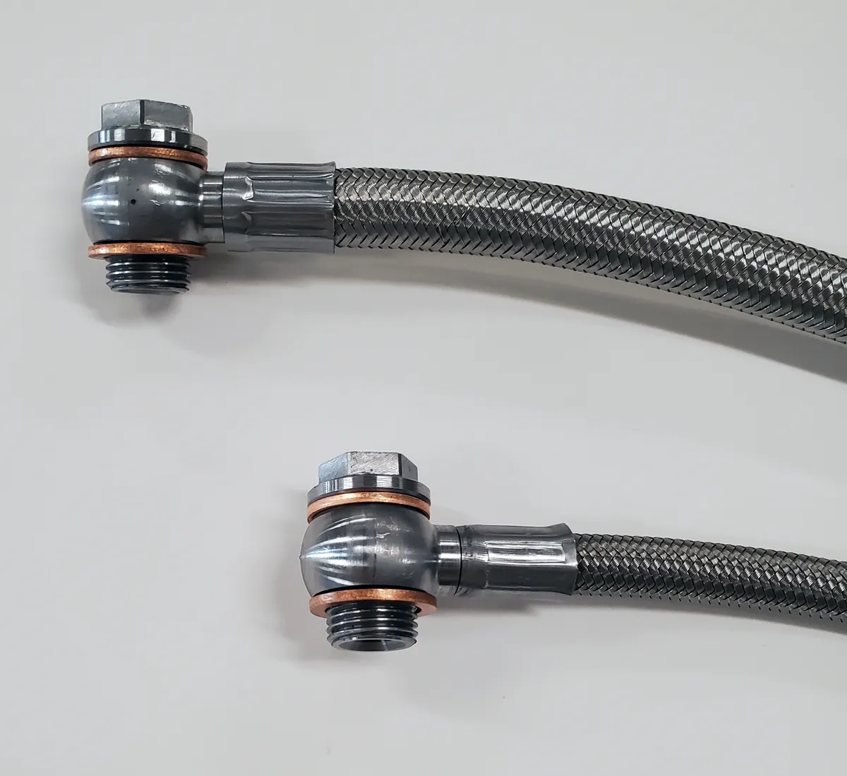 Borgeson stainless steel power steering hose kit; 2 pc. with banjo fittings. Fittings are crimped on one end. Connects GM pump to Borgeson conversion boxes part numbers 800110; 800111; 800114; 800115; 800117; 800126; 800127; 800131; 999062. product image