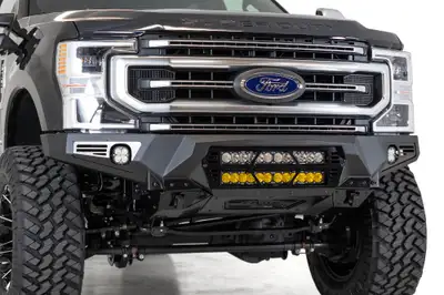 Addictive Desert Designs The Addictive Desert Designs Bomber front bumper brings the ultimate combination of form and function to the Ford F250F350. A full 316 aluminum skid plate offers superior protection while keeping the bumper lightweight. Three different light options ar