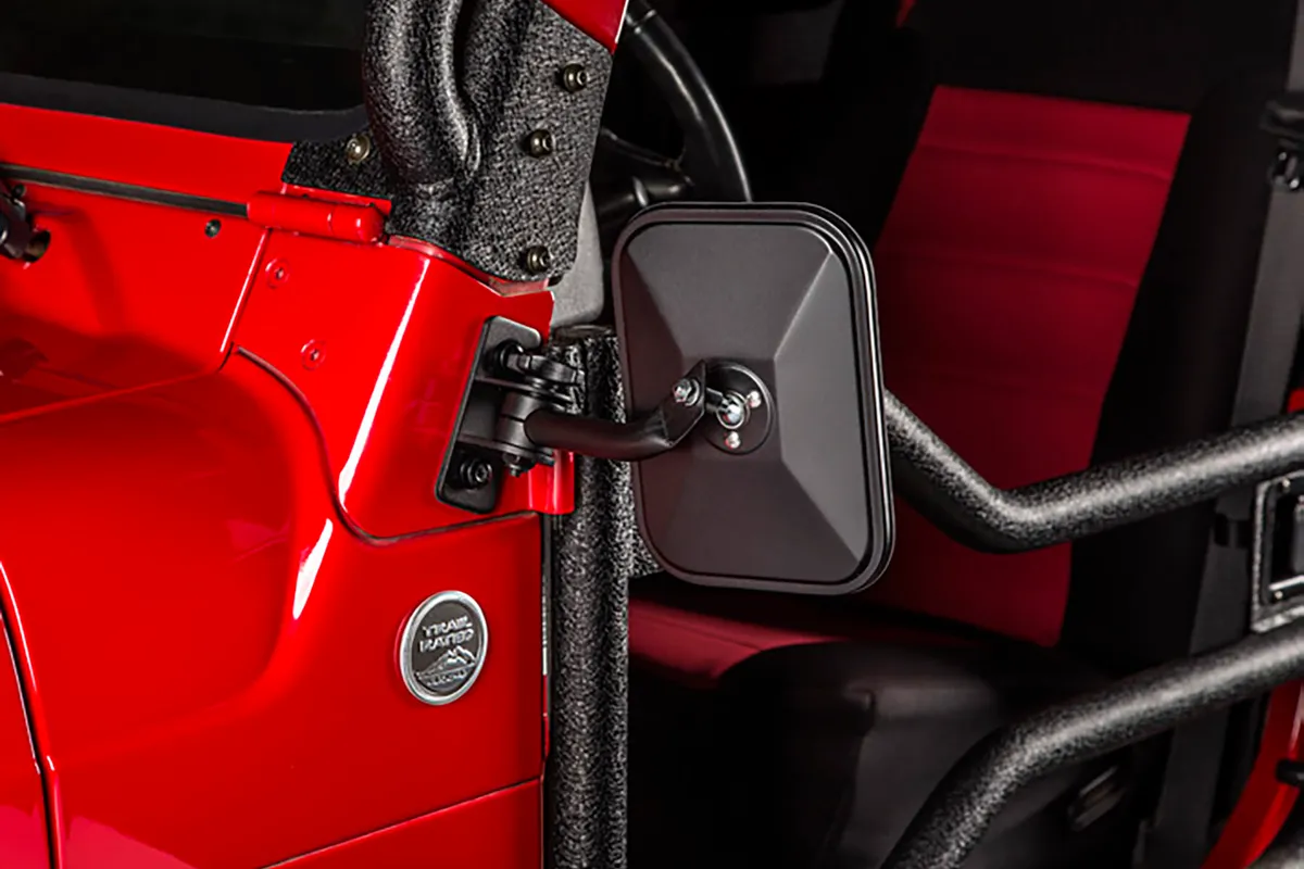 Rugged Ridge black steel stubby trail mirrors with rectangular heads mounted on Jeep Wrangler showing compact design