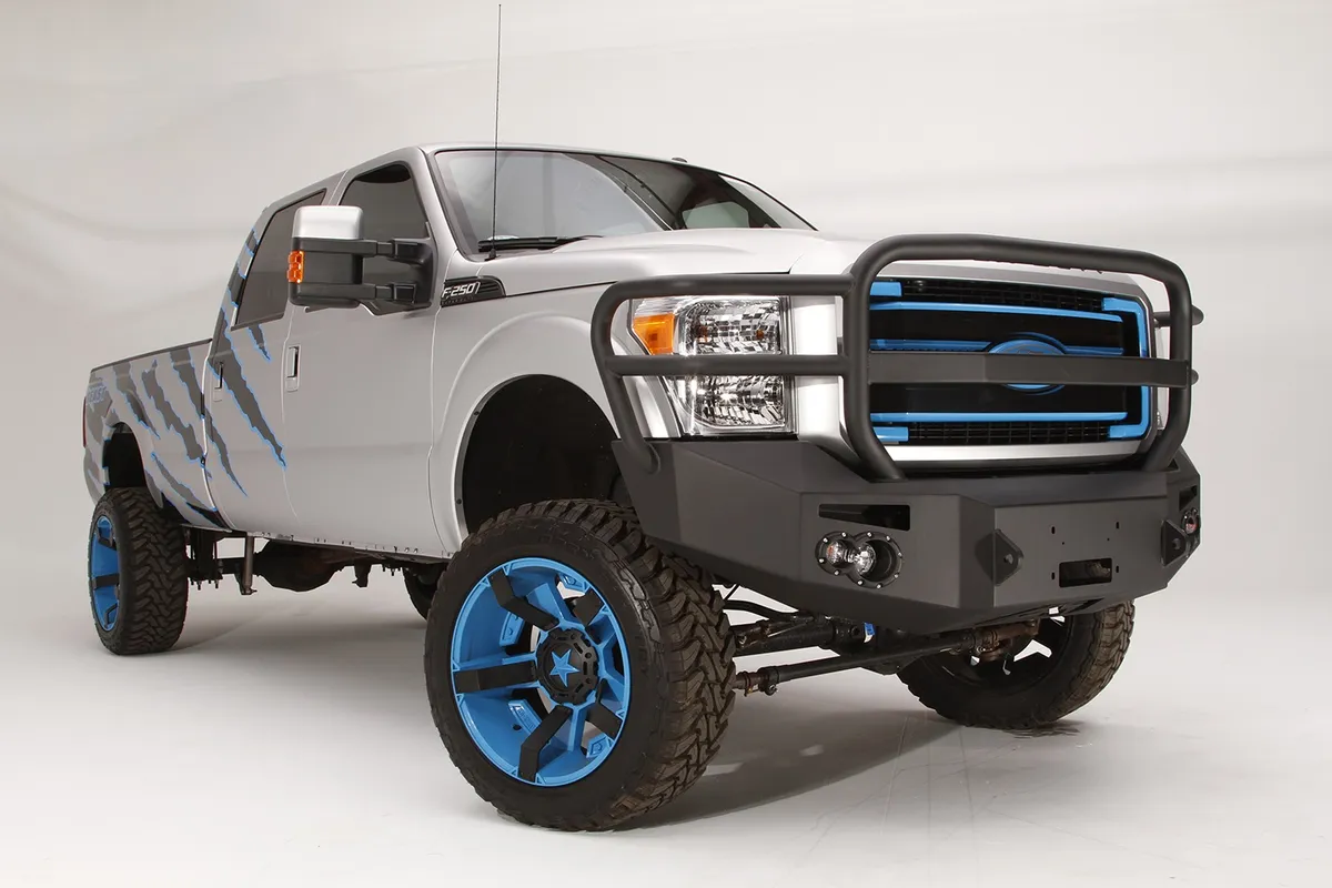 Premium Heavy Duty Winch Front Bumper; 2 Stage Black Powder Coated; w/Full Grill Guard; Incl. 1 in. D-Ring Mounts/Light Cut-Outs w/Hella 90mm Fog Lamps And 60mm Turn Signals; product image