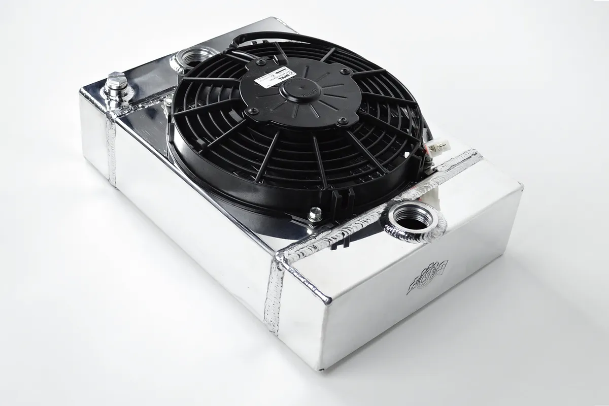 Universal Drag Race / Tuck Radiator -10.5H" x 10L" x 3.6W" (5.65" w/fan) - Includes 9-inch SPAL fan - Includes inlet/outlet kit (1.25 or -16) + installation brackets product image