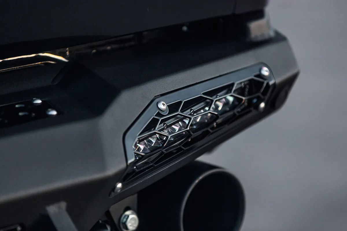 2017 Ford Raptor Honeybadger Rear Bumper With Tow Hooks And Backup Sensors With 10 sr LED Light Bar Mounts And Dually Mounts in Hammer Black With Satin Black Panels. product image