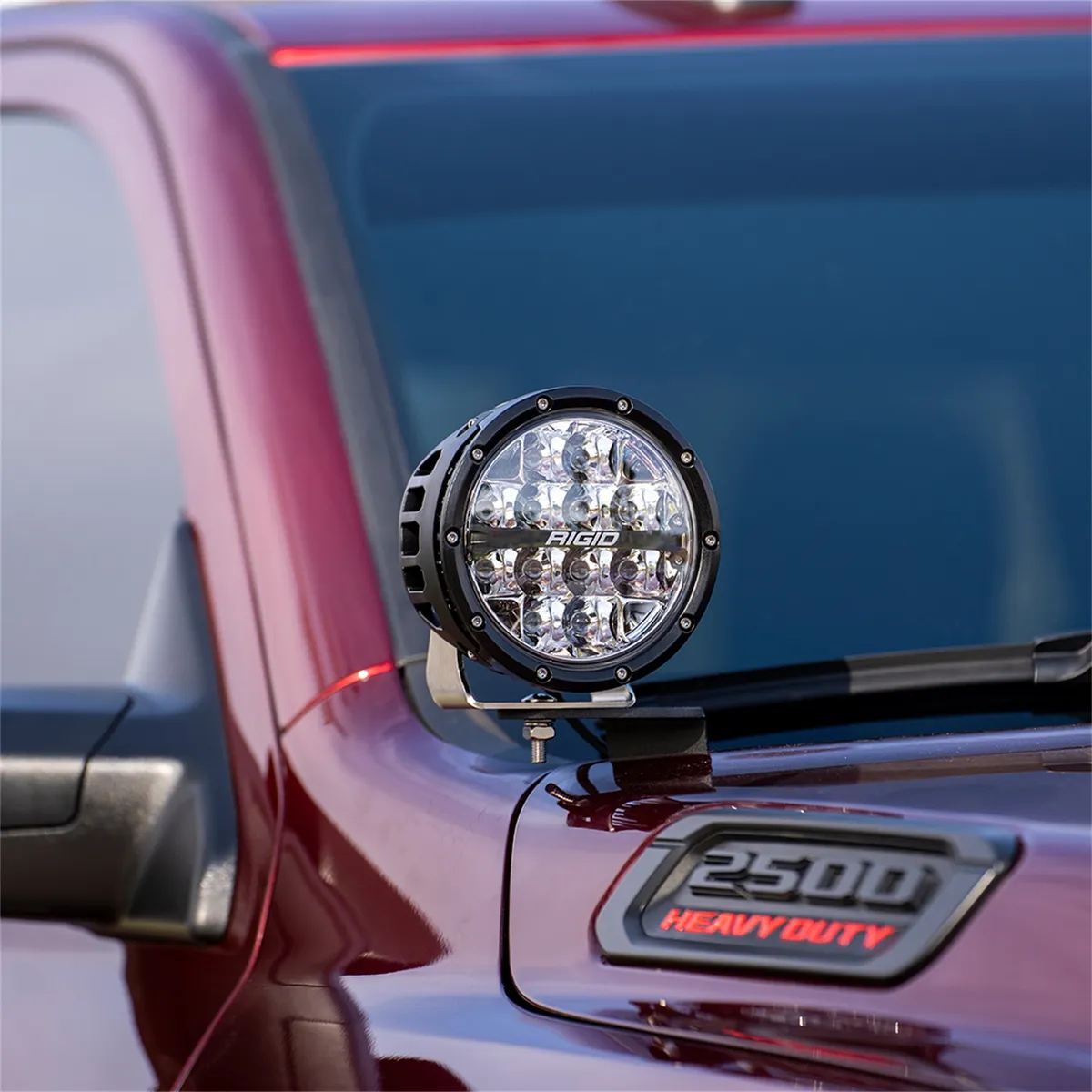 This RIGID A-Pillar mount kit is designed for the 2019+RAM 2500 and 3500; it includes two A-Pillar mounting brackets; two 6 inch 360-Series Amber Backlight Drive lights; two black light covers; two amber light covers; and a wiring harness. product image