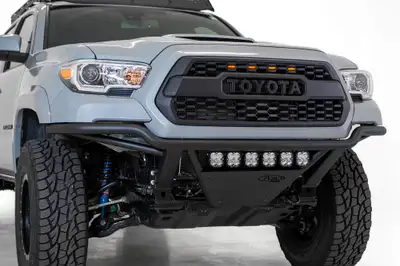 Addictive Desert Designs The Add Pro Bolt-On Bumper Stays Flush With The Front Your Toyota Tacoma. The Pro Bolt-On Truly Contours The Body Lines of The Tacoma Without The Need For a Plastic Valence. Built With .120 Wall Steel Tubing For Strength And Durability And an Aluminum sk