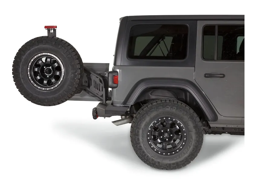 Warn WARN - Mounts to Elite Rear Bumper and can accommodate up to a true 40-inch tire. Made of durable black steel and wearing a corrosion-resistant powder-coated
