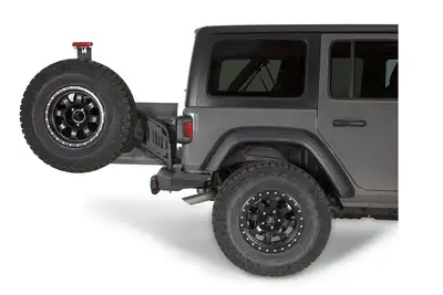Warn WARN - Mounts to Elite Rear Bumper and can accommodate up to a true 40-inch tire. Made of durable black steel and wearing a corrosion-resistant powder-coated
