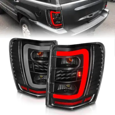 ANZO USA LED Tail Lights w Light Bar Black Housing Clear Lens Jeep Grand Cherokee 1999-2004