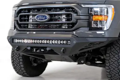Addictive Desert Designs Ford F150 Stealth Fighter Winch Front Bumper with 10 Cube Mounts Universal Plate on op and 10 SR Cube Mounts on Sides with SENSOR Cutouts with D-ring Mounts in Hammer Black with Satin Black panels 2021 Ford F-150