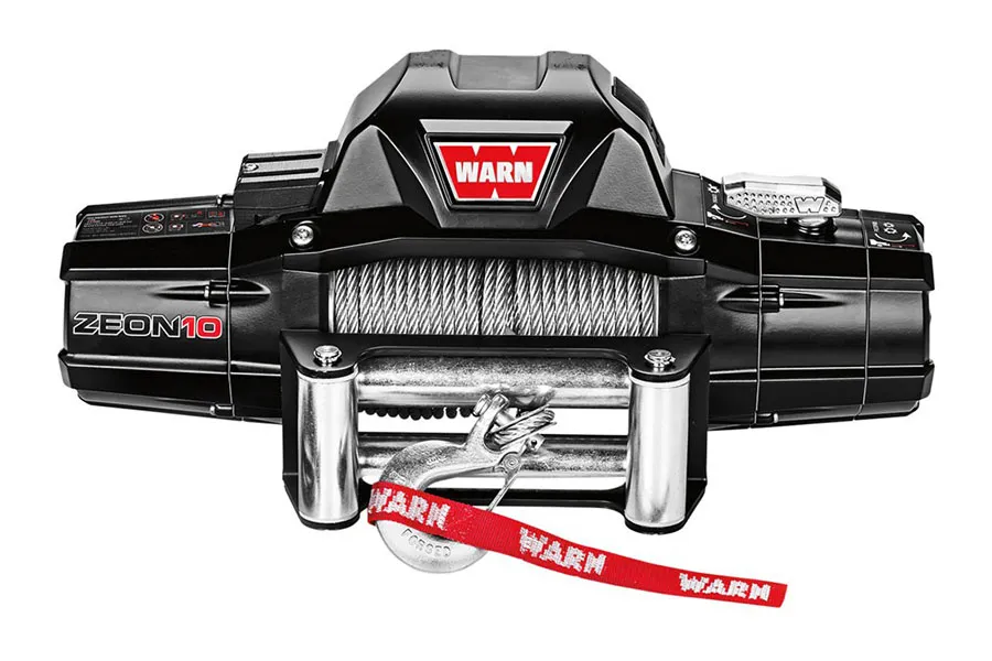 Warn Zeon 10 electric winch with black metal housing, steel rope, and roller fairlead mounted on vehicle bumper