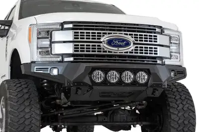 Addictive Desert Designs The Addictive Desert Designs Bomber front bumper brings the ultimate combination of form and function to the Ford F250F350. A full 316 aluminum skid plate offers superior protection while keeping the bumper lightweight. Three different light options ar